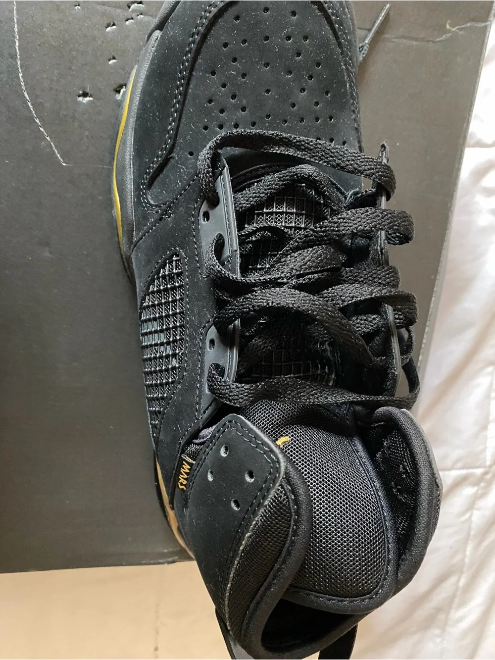 Jordan Men's Black Suede Sneakers with Gold Accent